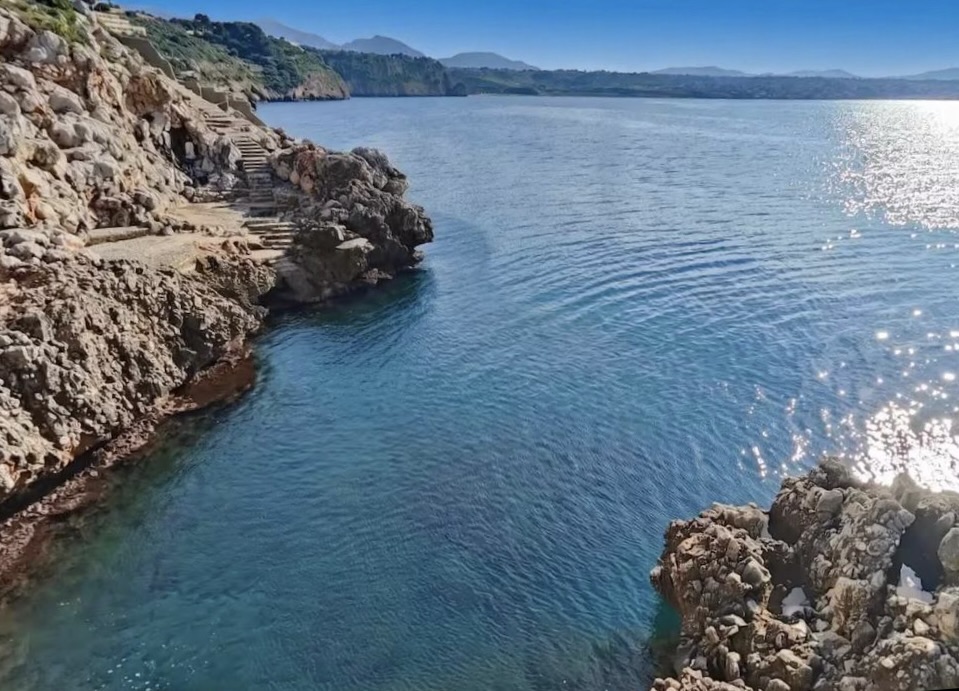 Rocky cove with stone steps near Terrasini