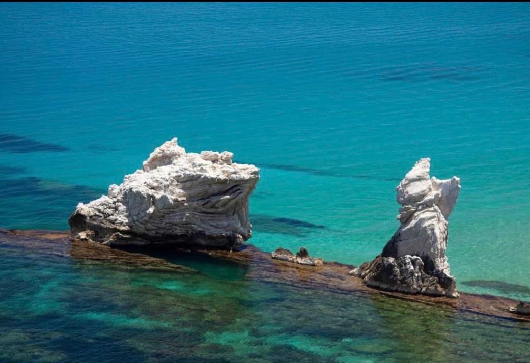 White rocks in the turquoise sea of Terrasini