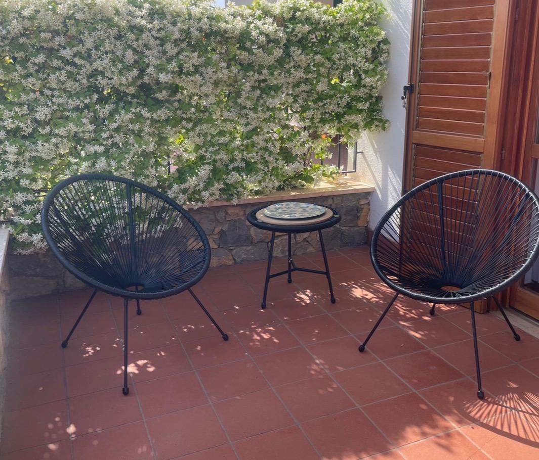 Terrace of Villa Lisa with chairs and flowers